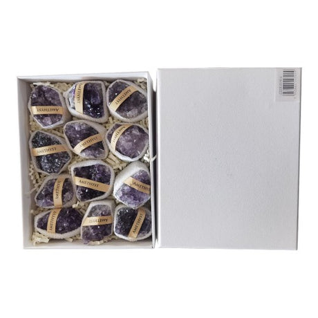 Stunning 4-6cm amethyst cluster in a 700g box, showcasing unique natural formations for decor and tranquility.