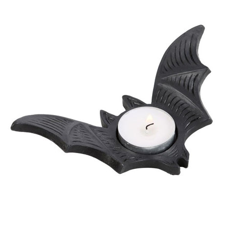 Bat Tealight Candle Holder in black resin features a flying bat design, perfect for Halloween decor and creating ambient shadows.