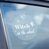Whimsical "Witch at the Wheel" window sign with moon and stars, perfect for adding magical charm to home or car decor.