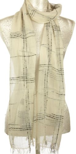 Textured grid scarf in cream, made from a soft viscose-cotton blend, versatile for any season and stylish layering.