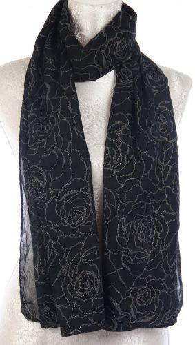 Elegant black scarf with gold dot pattern, measuring 70 x 180 cm, perfect for versatile styling in any season.