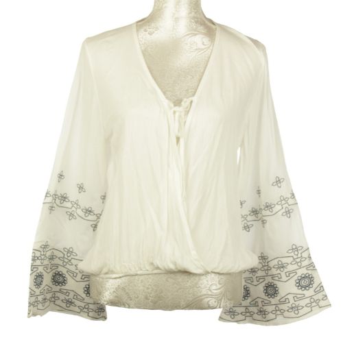 White Embroidery Summer Top made from 100% viscose, featuring intricate designs for stylish warm-weather comfort.
