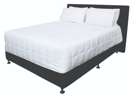 Luxurious white Snug Quilt by Dreamticket, made from 100% brushed microfiber, offering warmth and eco-friendly comfort.