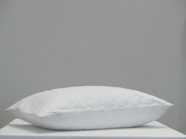 Quilted white pillow protector (73cm) with eco-friendly fill, soft microfibre cover, and envelope opening for comfort.