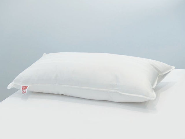 "Dream Lodge King Pillow: Luxurious, eco-friendly, hypoallergenic support with recycled microfibre fill and soft cotton cover."