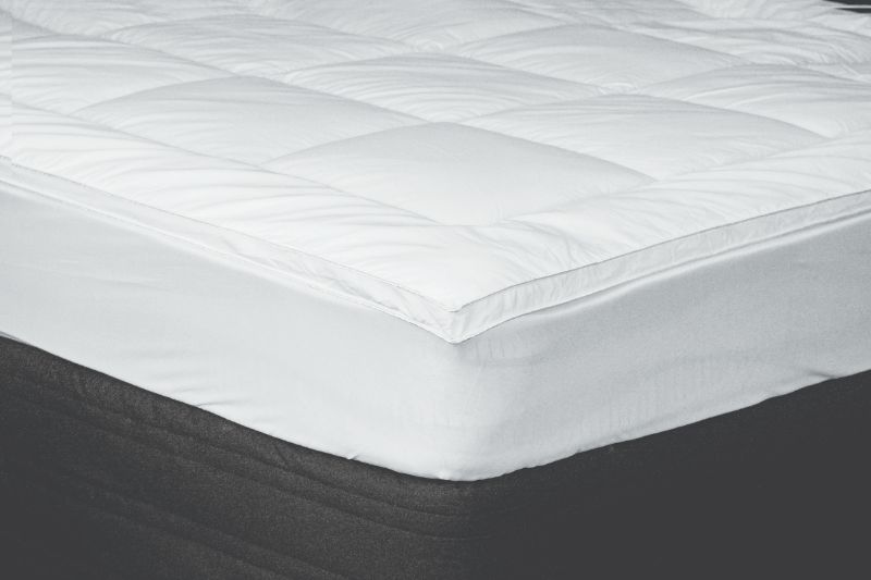 Luxurious white Loft Comfort Topper with 1000gsm microfibre fill, crafted from recycled plastics for Super King beds.