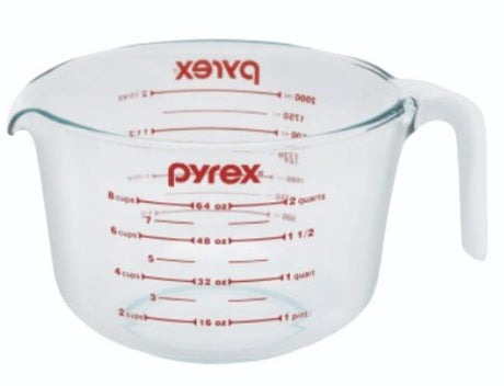 Clear glass Pyrex measuring jug (1.9L) with ergonomic handle and wide spout for precise pouring and easy measuring.