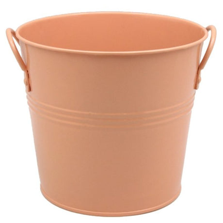 Apricot metal bucket with two handles, 18cm diameter, perfect for decor, storage, or as a stylish plant pot holder.