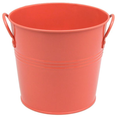 Vibrant coral metal bucket (18cm) with sturdy handles, perfect for storage or decoration in any home.