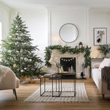 White ceramic Christmas tree set with three sizes, perfect for creating a festive ambiance in your home.