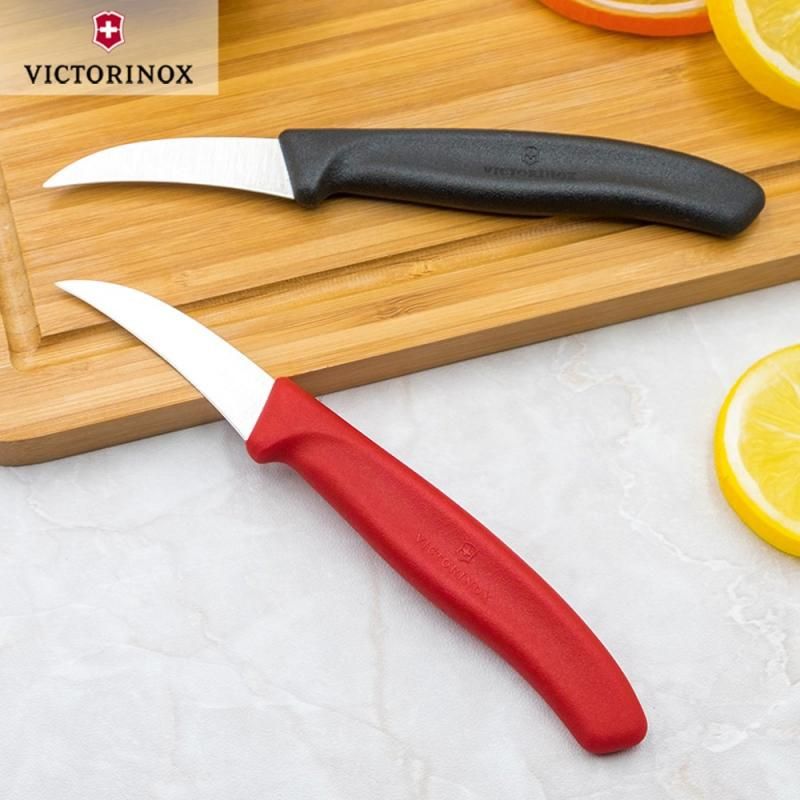 Victorinox 6 cm curved shaping knife with ergonomic handle and sharp Bird's Beak blade for intricate fruit and vegetable garnishing.