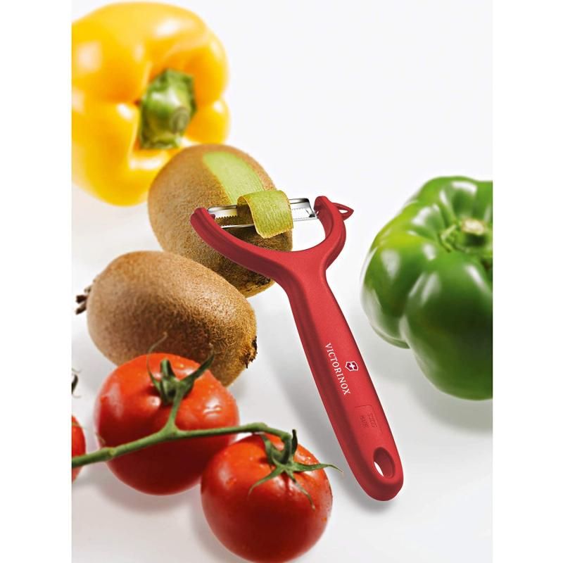 Victorinox red tomato and kiwi peeler with micro-serrated double edge and ergonomic handle for effortless peeling.