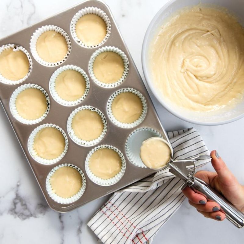 Nordic Ware Naturals® Muffin Pan with 12 cups for even baking, made of durable aluminum for lifelong use.