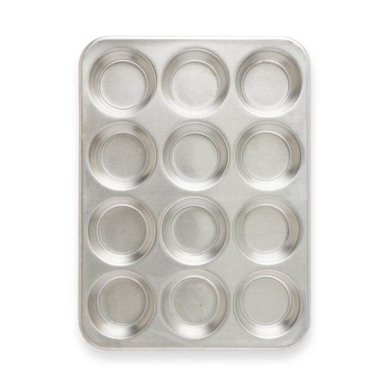 Nordic Ware Naturals® 12-cup muffin pan in aluminum for even baking, rust-resistant, and designed for lasting kitchen use.