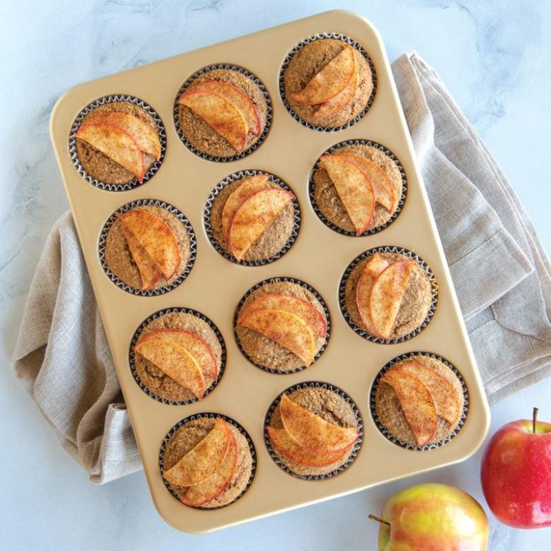 Nordic Ware 12-cup nonstick muffin pan, featuring aluminum construction for even baking and easy muffin release.