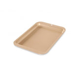 Nordic Ware Nonstick Compact Baking Sheet for baking cookies and cakes, featuring a durable, lightweight, and easy-to-clean design.