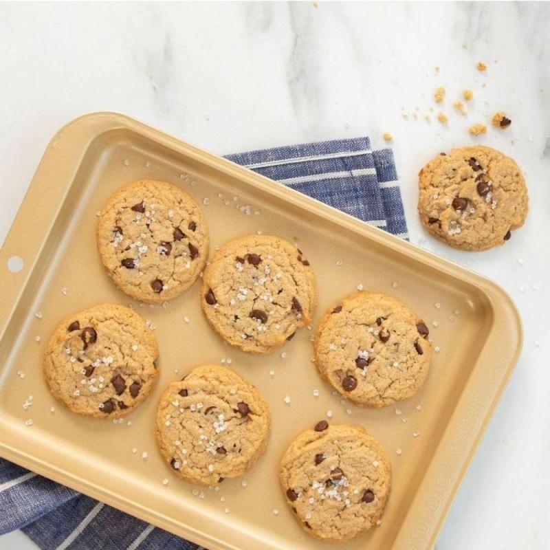 Nordic Ware Nonstick Compact Baking Sheet, lightweight and rust-resistant, ideal for baking small batches of cookies and cakes.