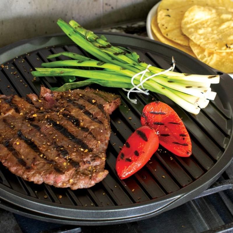 Nordic Ware 12" reversible round griddle featuring heavy cast aluminum, nonstick surface, and versatile cooking options.