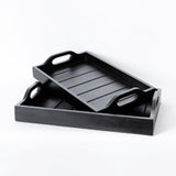 Stylish set of 2 black wooden trays made from eco-friendly timber, perfect for serving and home organization.