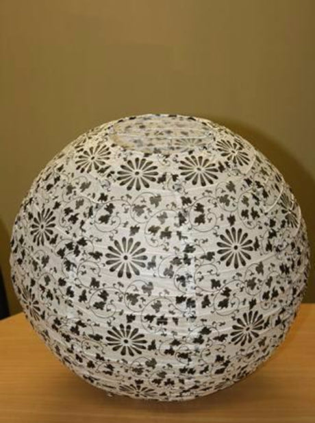 Five 16'' white floral paper lanterns with bamboo ribbing for elegant decor at events, featuring easy light bulb clips.