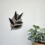 Delicate floral pebble wall art featuring willow leaves, crafted from premium VCM material, enhancing minimalist decor.