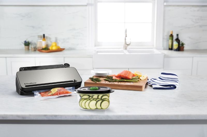 Sleek stainless steel vacuum sealer with multiple settings for preserving food freshness and reducing waste.