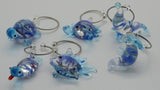 Colorful glass Sea Life Wine Charms set, featuring Kiwiana designs, perfect for personalizing wine glasses at gatherings.