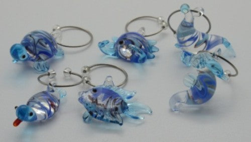 Colorful glass Sea Life Wine Charms set, featuring Kiwiana designs, perfect for personalizing wine glasses at gatherings.