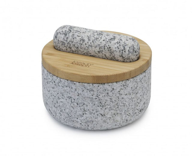 Elegant Joseph Joseph Dash Pestle & Mortar with reversible bamboo lid, made from natural granite, ideal for grinding spices.