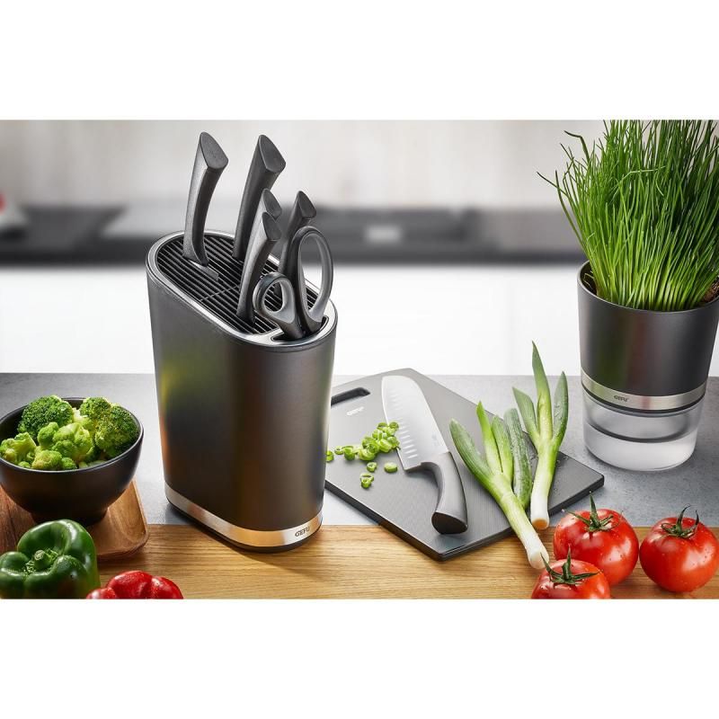 Sleek black Gefu Smartline Knife Block with stainless steel edges, storing up to 28 knives and featuring a large slot for scissors.