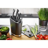 Sleek black Gefu Smartline Knife Block with stainless steel edges, storing up to 28 knives and featuring a large slot for scissors.