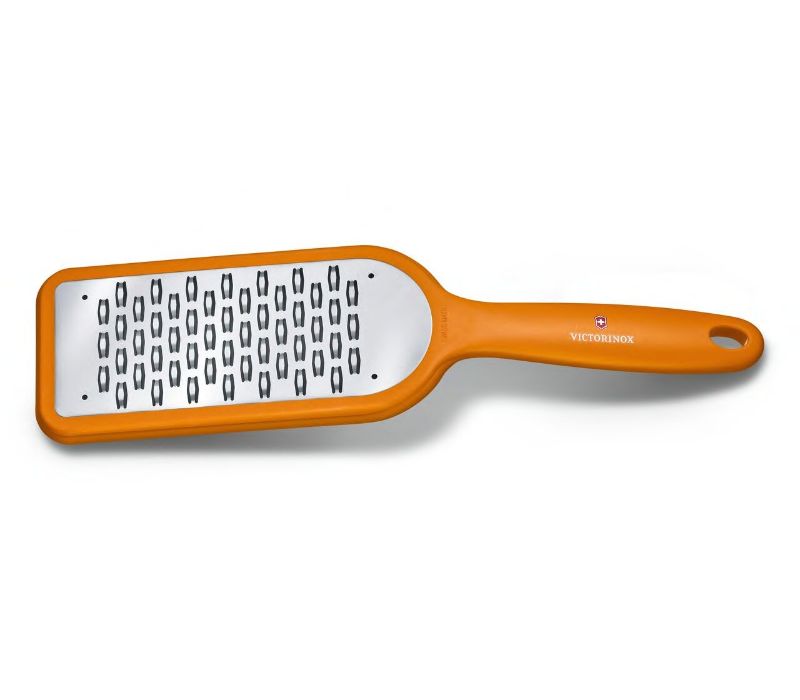 Victorinox orange grater with bidirectional blade, perfect for textured shavings of chocolate, cheese, and carrots.