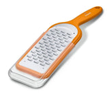 Vibrant orange Victorinox Ribbon Edge Grater with bidirectional blade, perfect for textured shavings of cheese, chocolate, and vegetables.