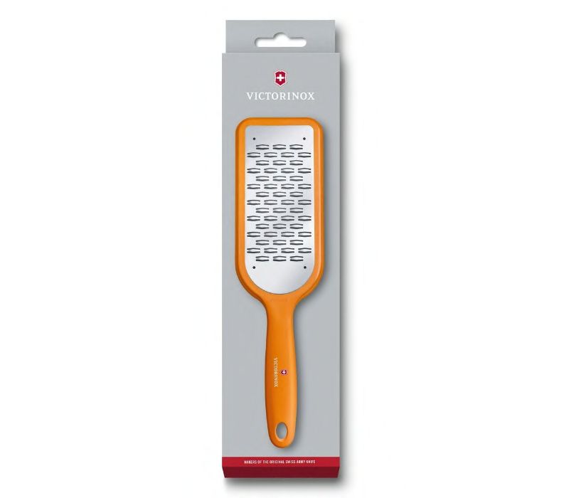 Victorinox Ribbon Edge Grater in orange with bidirectional blade for effortless grating of chocolate, cheese, and vegetables.