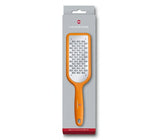 Victorinox Ribbon Edge Grater in orange with bidirectional blade for effortless grating of chocolate, cheese, and vegetables.