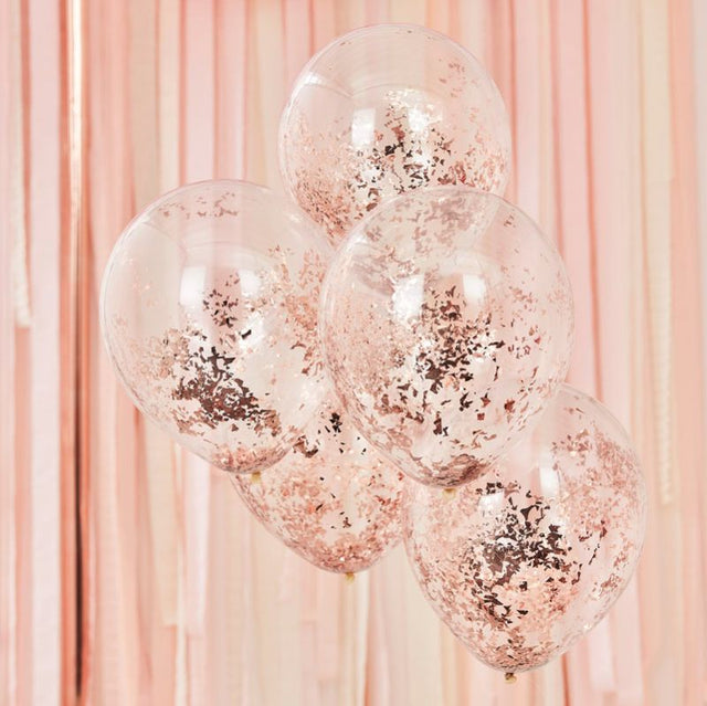 Rose gold confetti-filled balloons for elegant celebrations, perfect for adding sparkle to any event decor.