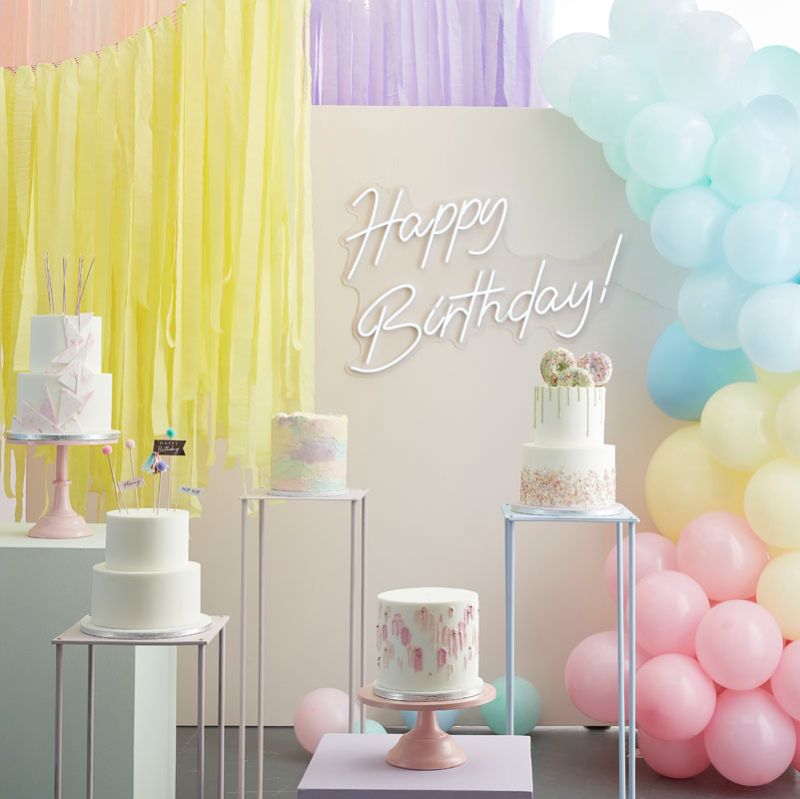 Pastel balloon arch kit featuring pink, mint, yellow, and blue balloons for vibrant party decor and easy assembly.