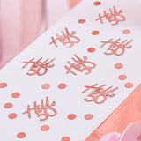 Rose gold confetti for 50th birthday, featuring 'Hello 50' pieces and mini circles for elegant party décor.