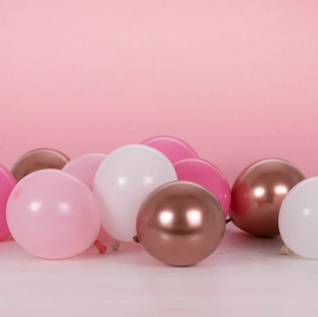 Blush and rose gold balloon pack with 40 vibrant balloons for stylish celebrations, perfect for parties and baby showers.