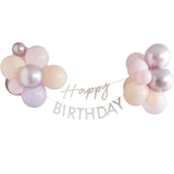 Pastel pink 'Happy Birthday' bunting with assorted biodegradable balloons, perfect for festive celebrations.