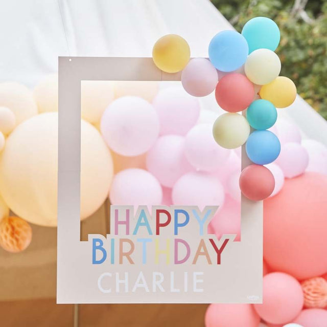 Customizable multicolored photo booth frame with balloons for vibrant birthday celebrations and memorable group photos.