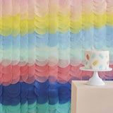 Vibrant rainbow tissue paper disc backdrop measuring 200cm, perfect for festive celebrations and photo booths.