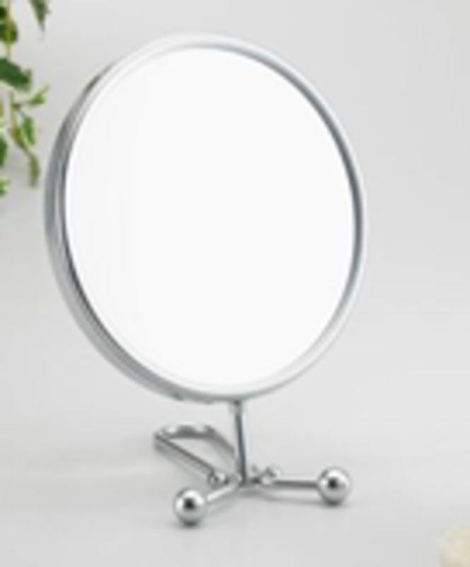 Sleek chrome round folding mirror with dual views, 5x magnification for precise beauty routines and portable convenience.