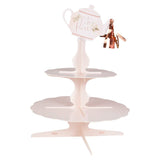 Floral two-tier cake stand with whimsical teapot design, perfect for showcasing treats at parties and tea gatherings.