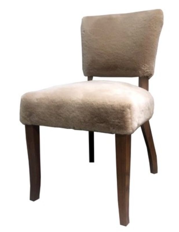 Elegant dining chair upholstered in soft Sherpa synthetic sheep wool, height 93 cm, perfect for modern and classic interiors.