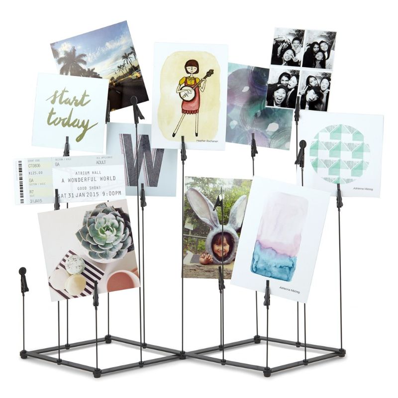 Stylish black photo display with metal clips for up to 15 photos, featuring adjustable height wires for custom arrangements.