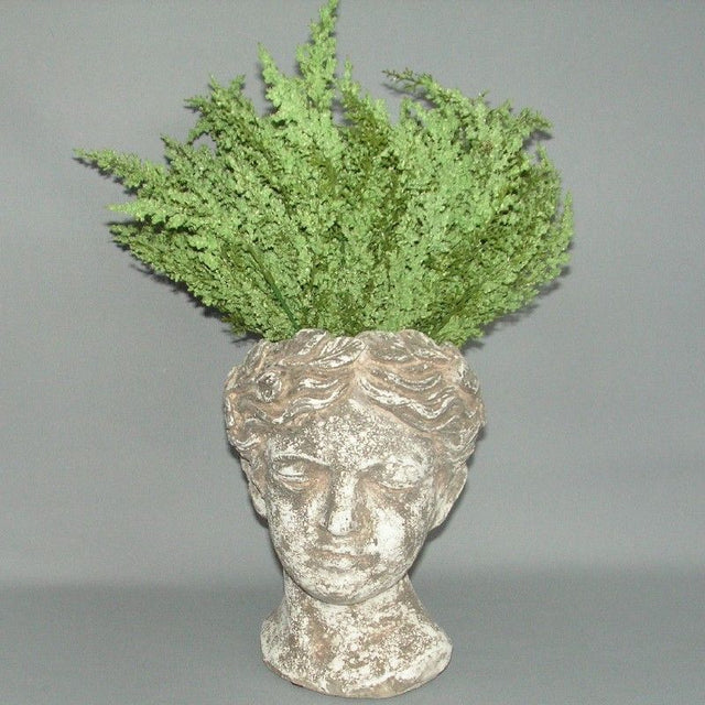 Whimsical green head-shaped planter (22cm) for succulents and flowers, perfect for indoor or outdoor decor.