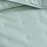 Elegant textured waffle weave coverlet for single or double beds, offering warmth and style in a luxurious cotton-polyester blend.