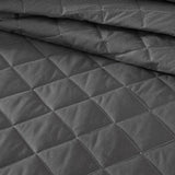 Elegant Logan & Mason Essex Charcoal bedspread with herringbone design, white edge, perfect for queen-sized beds.