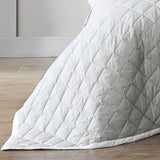 Elegant Logan & Mason Essex Pewter bedspread with quilted herringbone design and crisp white edges, perfect for queen beds.